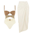 Load image into Gallery viewer, Champagne beige and ivory luxury one-piece swimsuit with gold hardware and coordinating ivory resort sarong skirt
