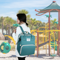 Load image into Gallery viewer, Versatile functionality as a diaper bag, changing table, and travel bassinet