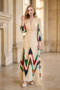 Load image into Gallery viewer, woman wearing geometric print long sleeve midi dress beige colorful pattern elegant spring resort outfit