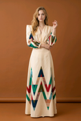 Load image into Gallery viewer, woman wearing geometric print long sleeve midi dress beige colorful pattern elegant spring resort outfit