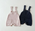 Load image into Gallery viewer, Regan Knit Romper – your child's go-to outfit for spring adventures! This romper is not just soft and cozy but also stylish with its handy pockets at the front, perfect for storing little treasures found during outdoor play.
