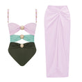 Load image into Gallery viewer, Pink and black luxury one-piece swimsuit with signature gold hardware and matching pink draped resort skirt
