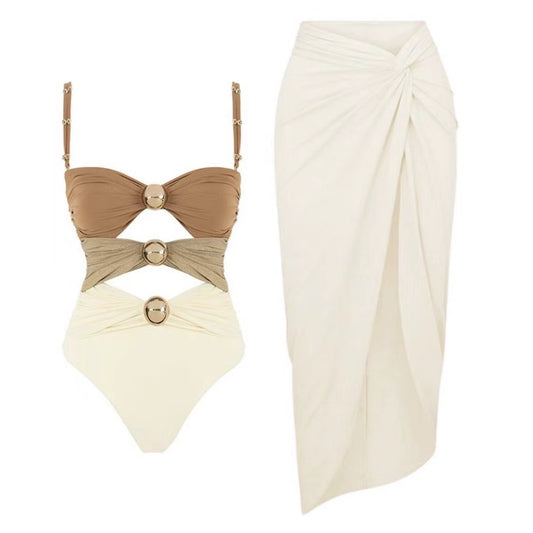 Champagne beige and ivory luxury one-piece swimsuit with gold hardware and coordinating ivory resort sarong skirt