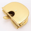 Load image into Gallery viewer, top handle and shoulder strap inspired by African heritage jewelry and modern sculptural design
