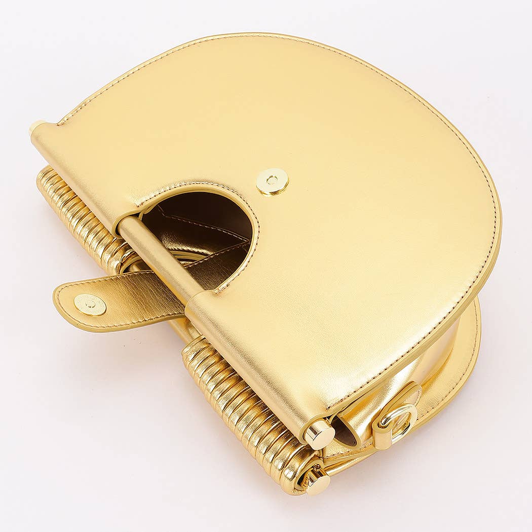 top handle and shoulder strap inspired by African heritage jewelry and modern sculptural design