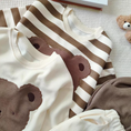 Load image into Gallery viewer, 1 super cozy Top featuring a large Baby Bear face, showcasing your little one's love for bears, and 1 comfy pair of Pants with Bear patches at the knees, adding a playful touch to their outfit.
