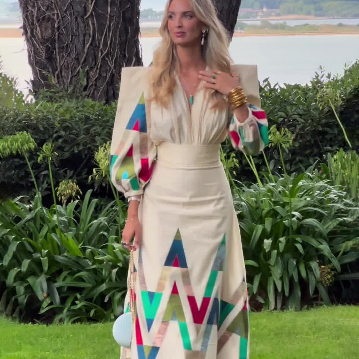 woman wearing geometric print long sleeve midi dress beige colorful pattern elegant spring resort outfit