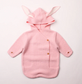 Load image into Gallery viewer, Morgan Bunny Ears Knit Blanket Sleeper features cute bunny ears and a hood, adding a touch of charm and playfulness to your child's sleep routine. Made from soft acrylic fibers, this sleeping bag is gentle on your child's skin and provides warmth and comfort throughout the night.
