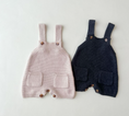 Load image into Gallery viewer, Regan Knit Romper – your child's go-to outfit for spring adventures! This romper is not just soft and cozy but also stylish with its handy pockets at the front, perfect for storing little treasures found during outdoor play.
