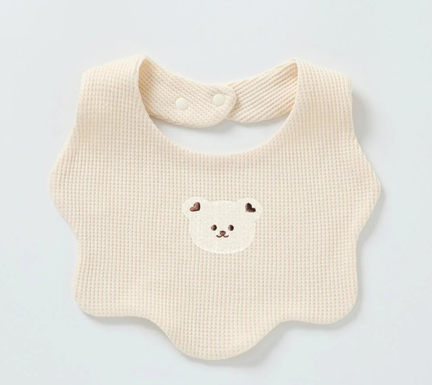 Renee Newborn Bear Bib – a must-have accessory for your little one's mealtime adventures! Made with double-layered pure cotton, this bib offers extra thickness and durability, ensuring a mess-free feeding experience. The adorable baby bear print 