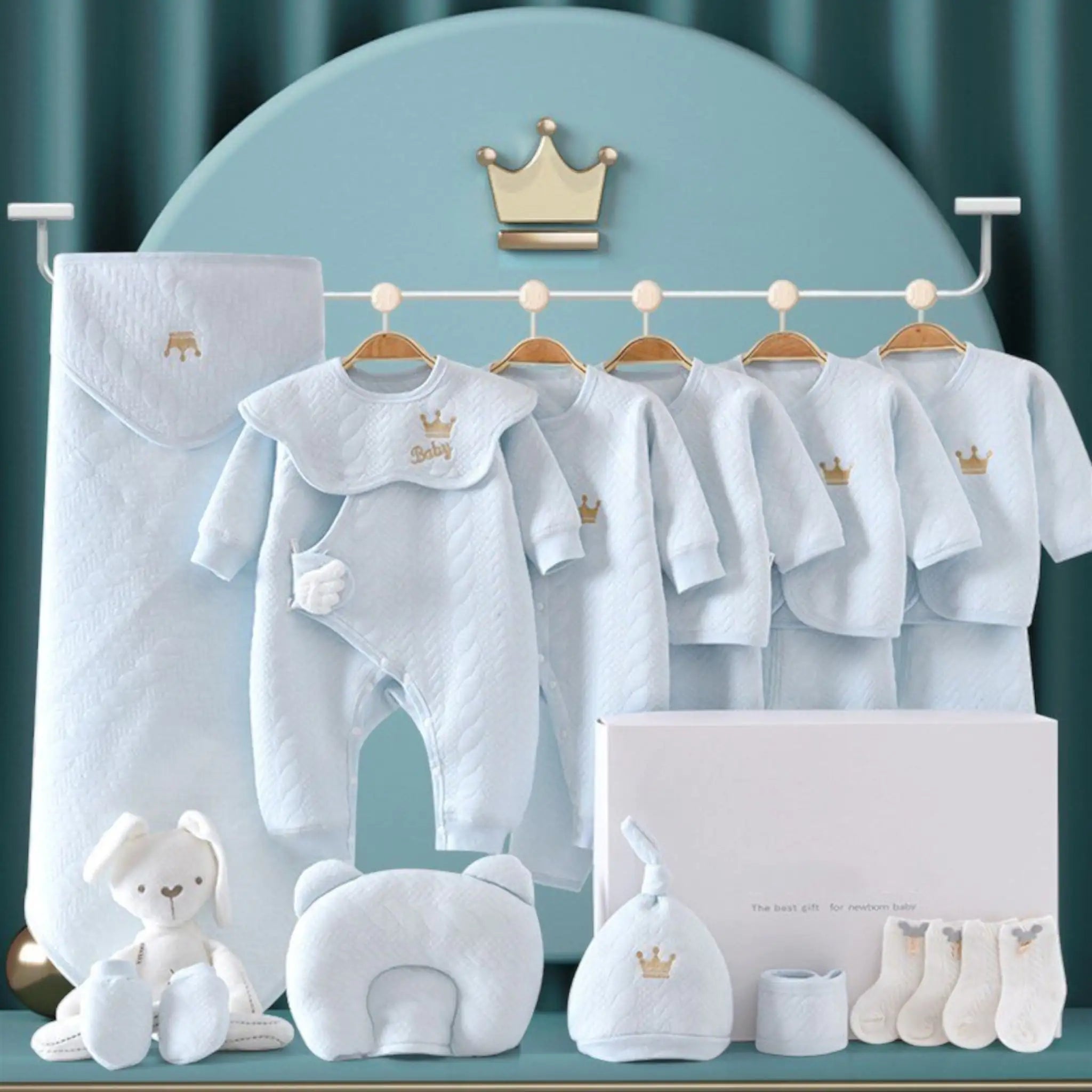 Jayce Unisex Newborn to 6 Months 13 Piece Baby Luxe Gift Set – because every bundle of joy deserves a grand entrance! Packed with snuggly onesies, a cozy blanket, adorable hats and booties, and even practical goodies like bibs and a plush toy, it's a celebration in a box! Perfect for baby showers or congratulating new parents, this set is a thoughtful and convenient choice.