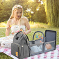 Load image into Gallery viewer, Versatile functionality as a diaper bag, changing table, and travel bassinet
