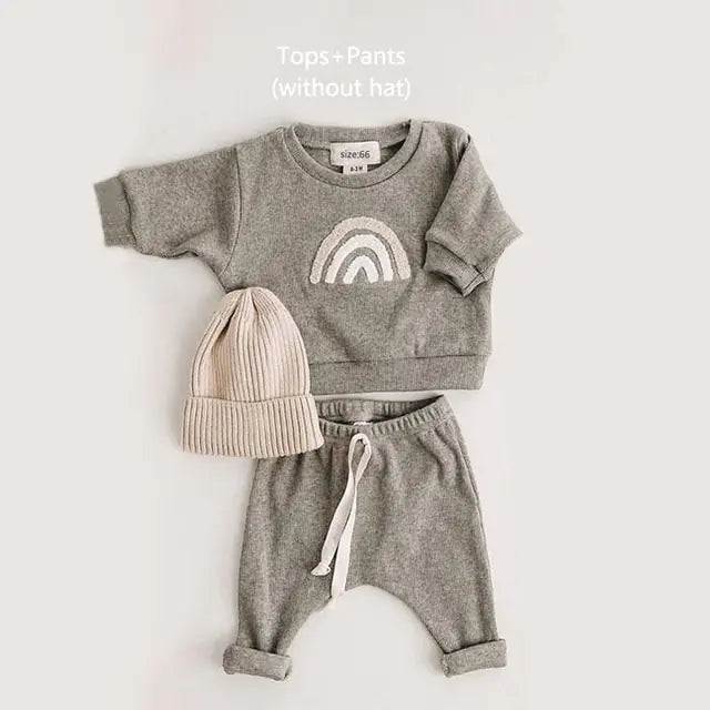 Kyle Unisex Spring Baby 2 Piece Sweatsuit Set. This dynamic duo features an adorable long-sleeved sweatshirt paired with cozy pants, giving your little one an instant dose of charm.