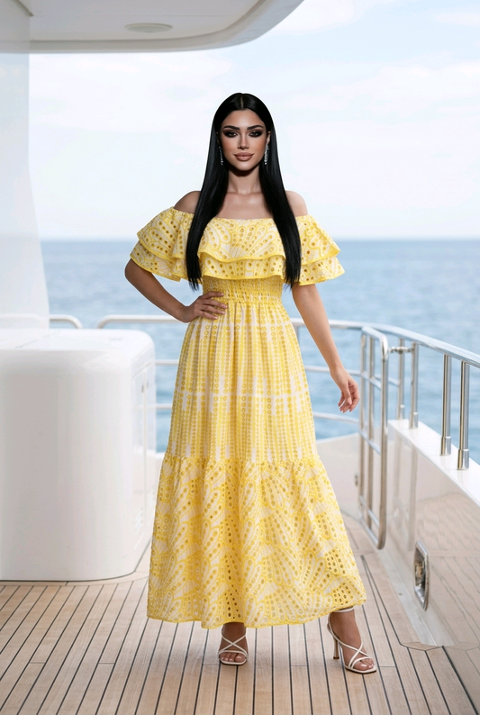 woman wearing yellow floral off shoulder maxi dress on beach summer vacation outfit