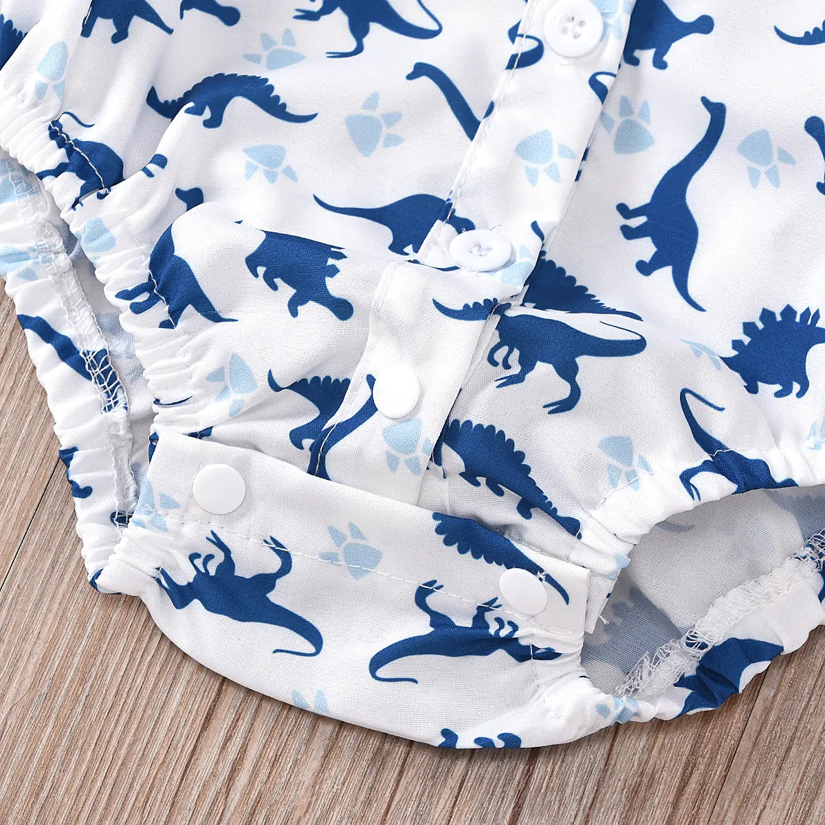 Wyatt 3 Pcs Pants Set with Hat Irresistibly charming baby boy outfit Crafted from cozy blend of cotton and polyester Dinosaur print pattern for added charm Short sleeves and snaps for easy diaper changes