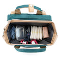 Load image into Gallery viewer, Versatile functionality as a diaper bag, changing table, and travel bassinet
